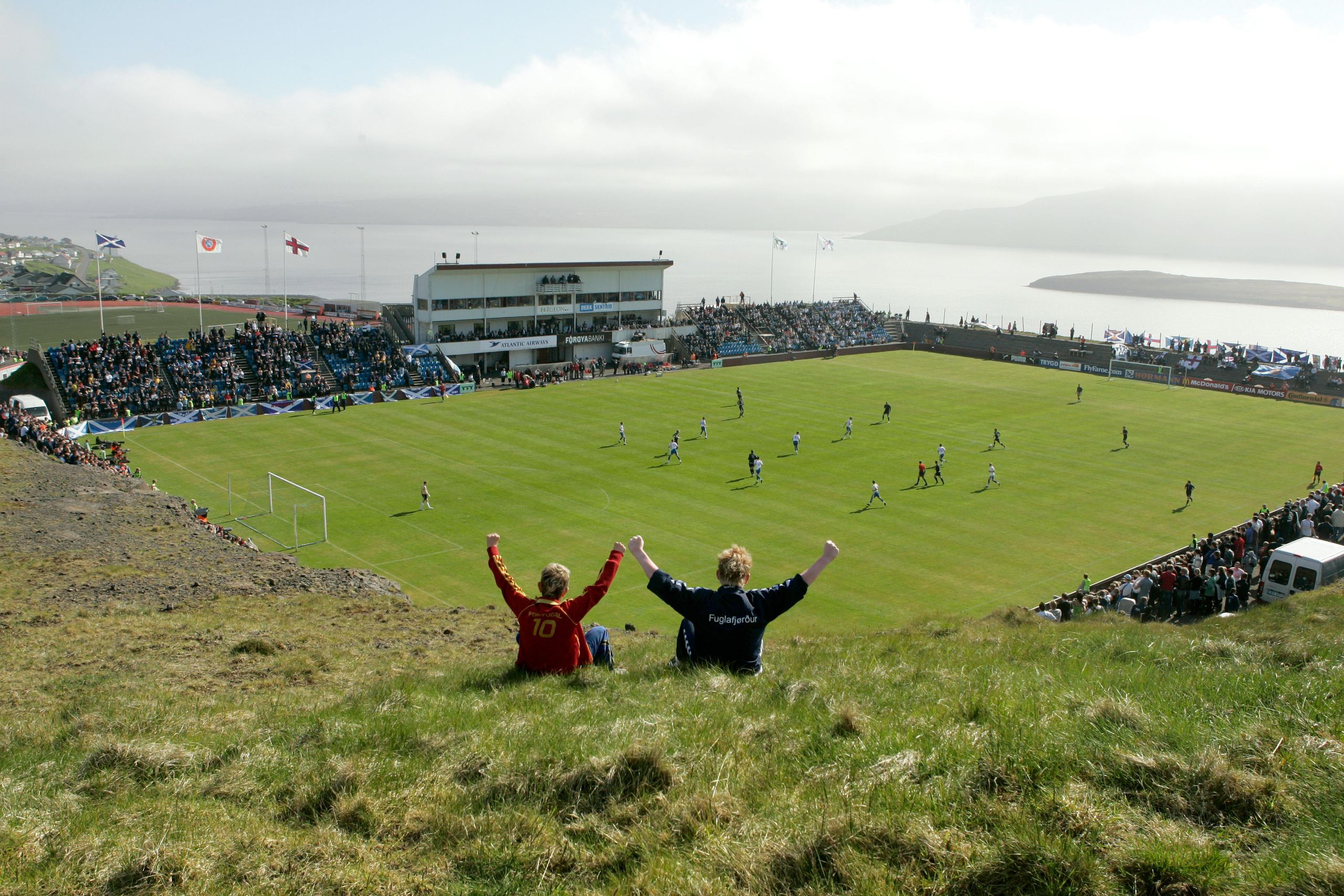 Ten of the planet’s most picturesque stadiums, from mountain kingdoms to remote fishing villages