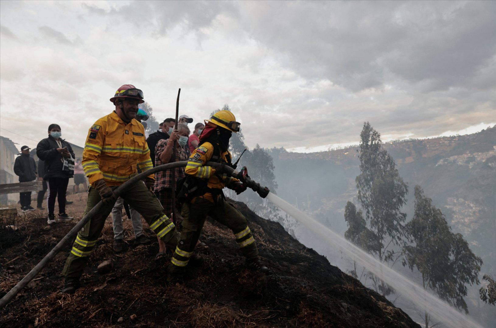 Residents help battle forest fires threatening homes in Ecuadorian capital | Climate