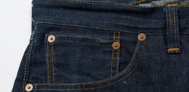 Para que serve o pino metálico nos bolsos da calça jeans?