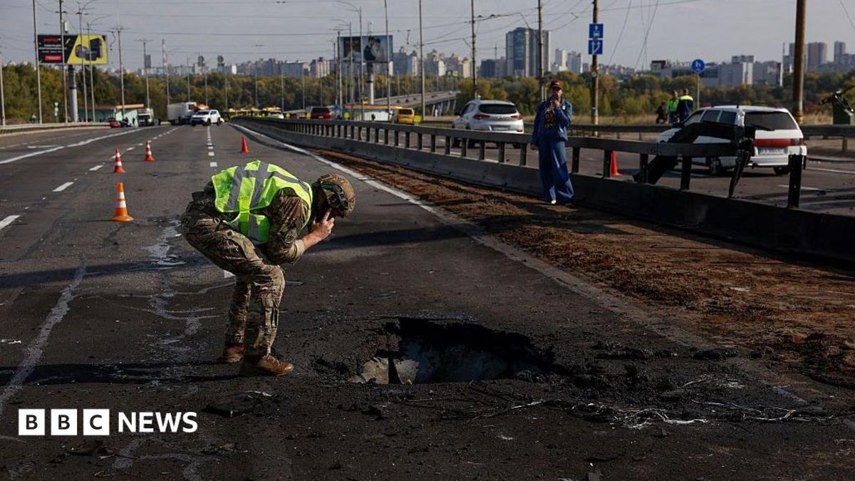 Kyiv bridge hit in further Russian drone attack as German chancellor makes surprise visit
